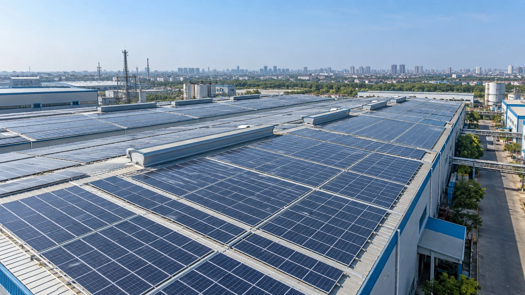 Illustrative industrial solar panels covering a factory roof